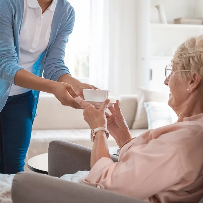 female nurse taking care of a senior